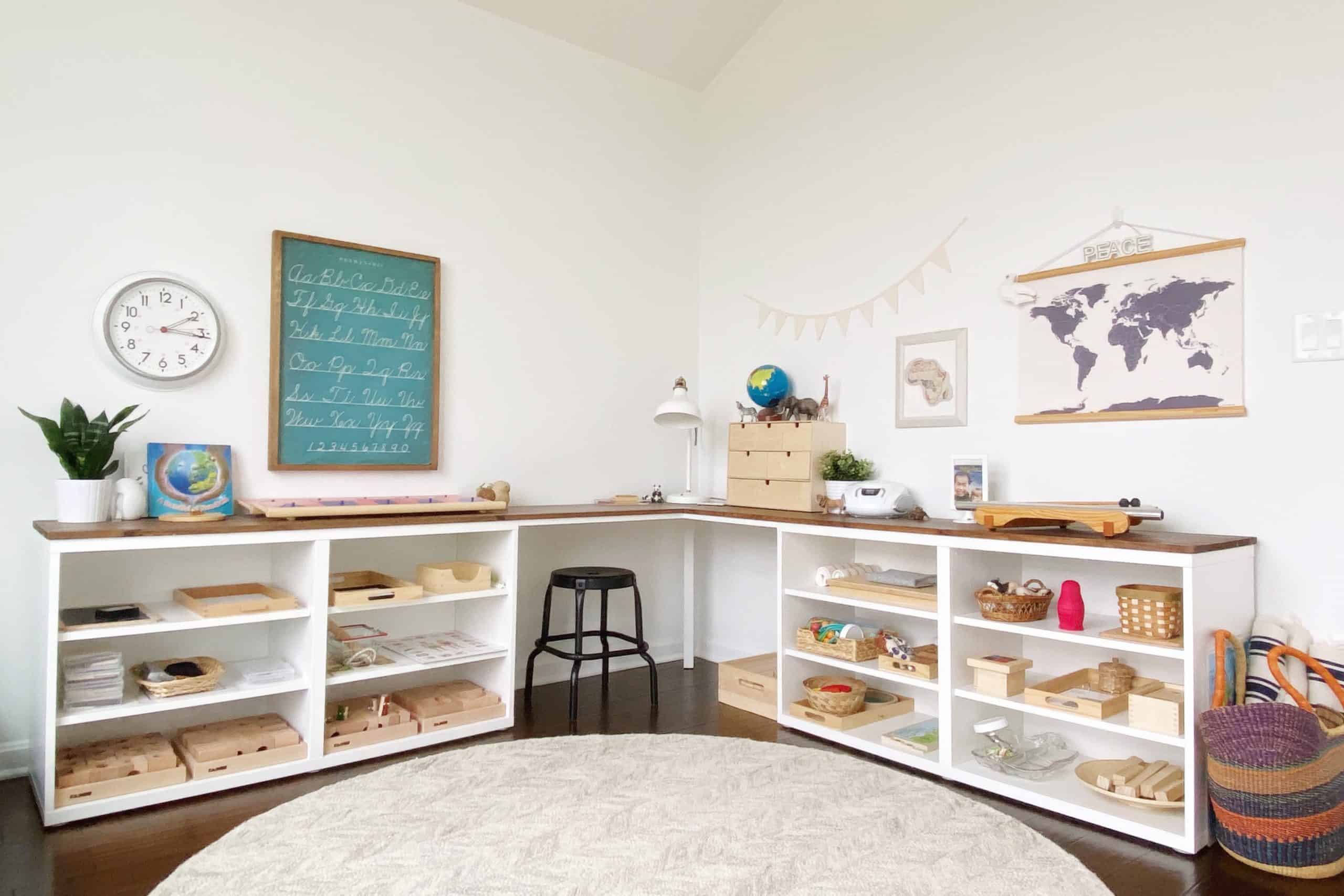 Tour a Montessori-inspired schoolroom + playroom for multiple children at www.freeandunfettered.com. You can also download a free guide to help you design your own prepared environment for your children at home. #montessori #designingspacesforchildren #preparedenvironment #montessoriathome #homeschoolroom #homeschooling 