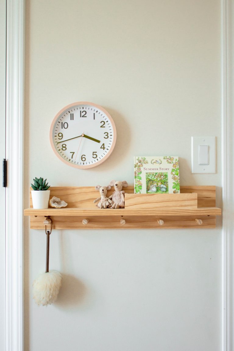 Learn how to build a wooden peg rail shelf with letter bin to help control the clutter in an entryway or bedroom area. It's a perfect small-space organization item that can be built for as little as $30 dollars! See the complete tutorial at www.freeandunfettered.com.