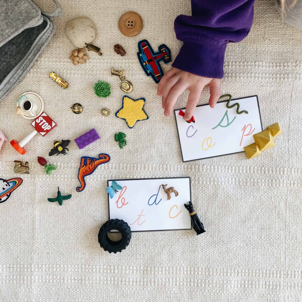 Using language objects to match beginning sounds onto a letter mat is a great way to practice phonemic awareness at home. #montessori